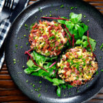 Overhead bacon stuffed mushrooms with Lancashire cheese and snipped chives.
