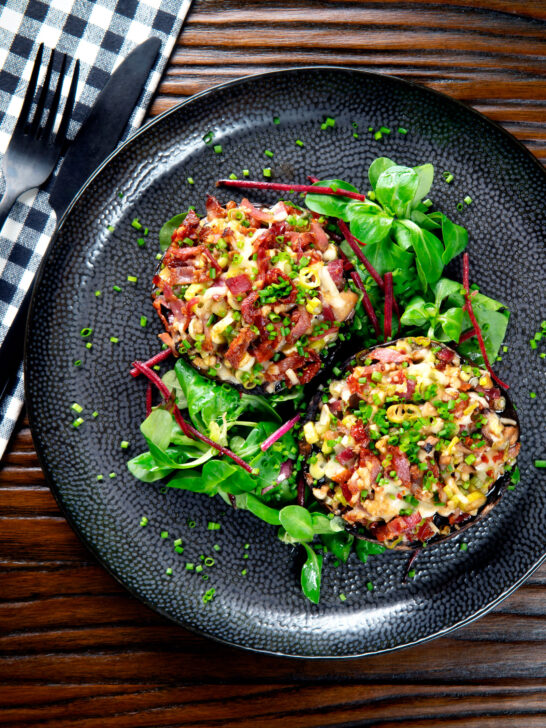 Overhead bacon stuffed mushrooms with Lancashire cheese and snipped chives.