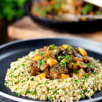 Moroccan lamb tagine with dates and almonds served with herby couscous.