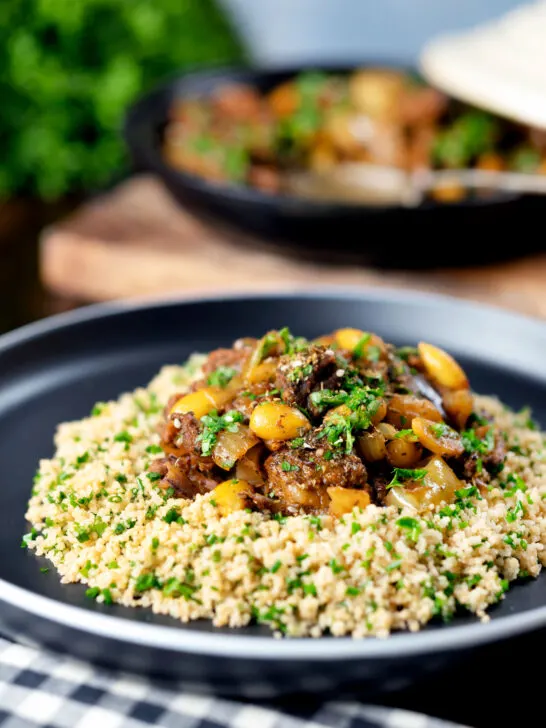 Moroccan lamb tagine with dates and almonds served with herby couscous.