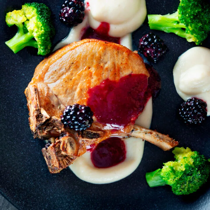 Pork chops with cider and blackberry sauce served with Jerusalem artichoke puree and broccoli.