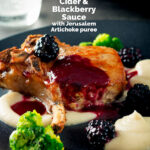 Baked pork chop with a cider and blackberry sauce with pureed Jerusalem artichokes featuring a title overlay.