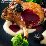Close-up pork chops with a cider and fresh blackberry sauce with Jerusalem artichoke puree featuring a title overlay.