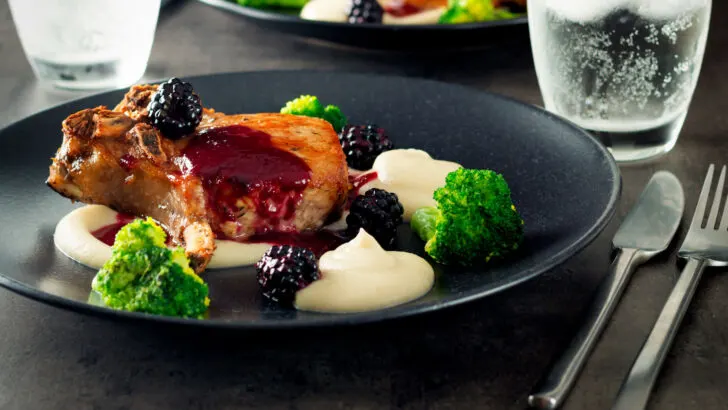 Pork chops with cider and blackberry sauce served with Jerusalem artichoke puree and broccoli.