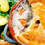 Overhead close up rabbit pot pie with a suet crust cut open to show creamy filling featuring a title overlay.