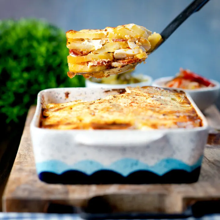 Rakott krumpli, a Hungarian layered potato bake or casserole with sausage, boiled egg and sour cream.