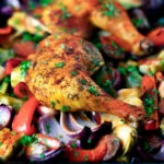 Spanish chicken and chorizo tray bake with peppers, onions and artichokes.