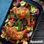 Overhead Spanish chicken and chorizo tray bake with peppers, onions and artichokes featuring a title overlay.