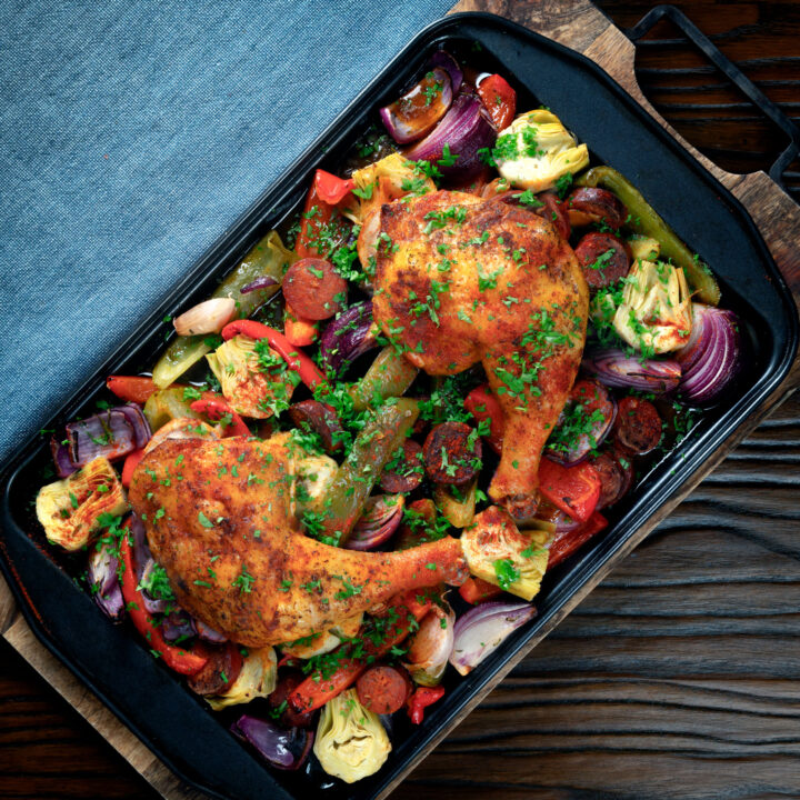 Spanish chicken leg and chorizo tray bake with peppers, onions and artichokes.