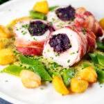 Black pudding stuffed chicken with a mustard sauce, potatoes and runner beans.