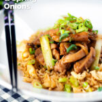 Ginger chicken with garlic and spring onions served with egg fried rice, featuring a title overlay.