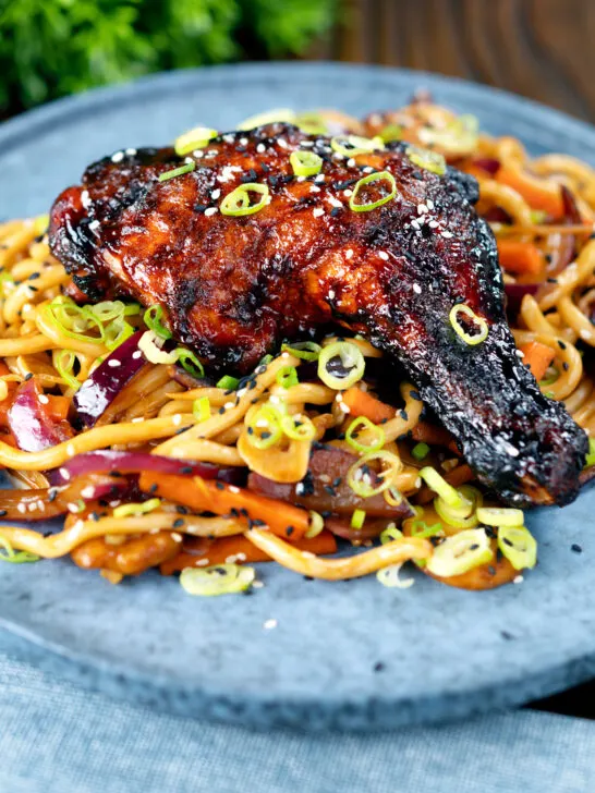 Chinese style char siu chicken leg served with sweet and sour noodles.