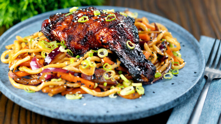 Char siu chicken legs served with sweet and sour udon noodles.