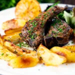 Greek lamb chops (paidakia) served with lemon garlic potatoes.