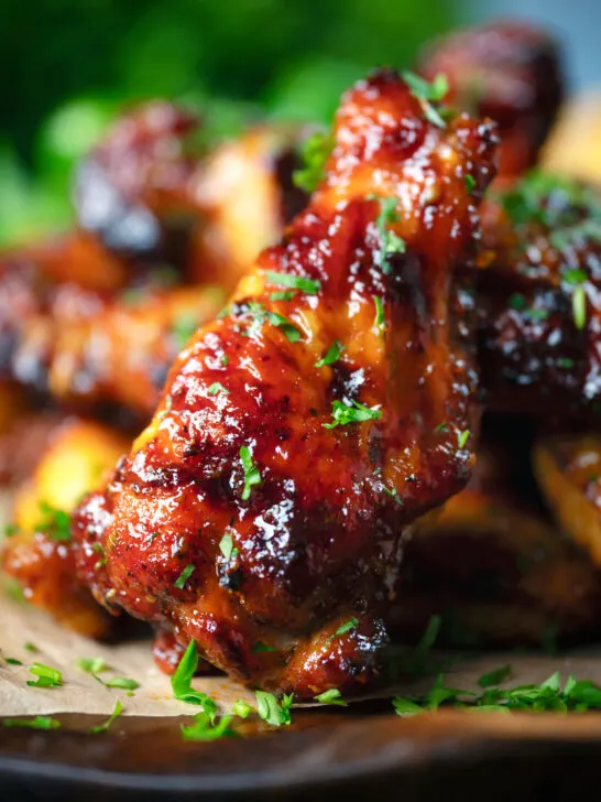 Close-up honey and sriracha glazed chicken wings.