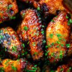 Overhead close-up honey and sriracha glazed chicken wings.