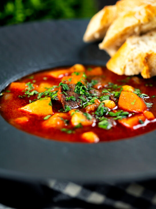 Traditional Hungarian goulash soup or Gulyásleves with csipetke (pasta).