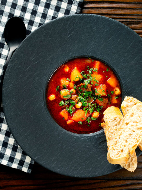 Overhead traditional Hungarian goulash soup or gulyásleves with csipetke (pasta).