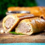 Homemade pork and apple sausage rolls in hot crust pastry.