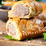 Close-up homemade pork and apple sausage rolls with hot crust pastry cut open to show filling, featuring a title overlay.