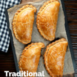 Overhead British Cornish pasties on a baking tray featuring a title overlay.