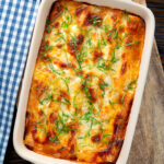 Overhead vegetarian cauliflower and ricotta stuffed and baked cannelloni.