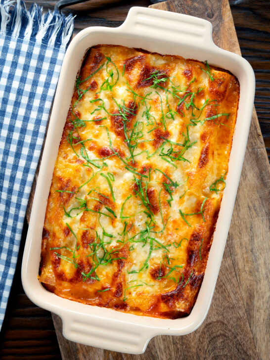 Overhead vegetarian cauliflower and ricotta stuffed and baked cannelloni.