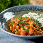 Indian inspired vegan carrot and chickpea curry served with coriander rice.