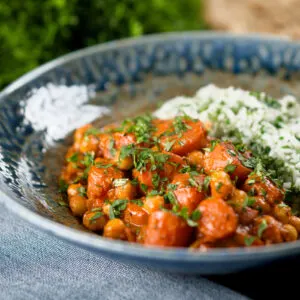 Indian inspired vegan carrot and chickpea curry served with coriander rice.