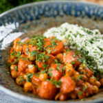 Indian carrot and chickpeas curry in a thick coconut milk sauce served with rice.