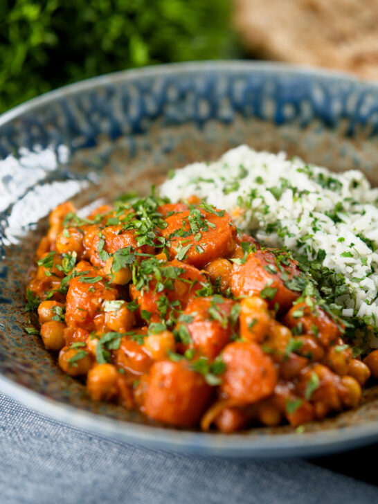 Indian carrot and chickpeas curry in a thick coconut milk sauce served with rice.