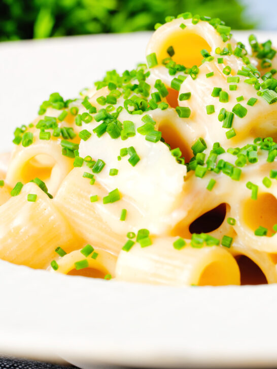 Close-up creamy cheesy smoked haddock pasta made with penne.