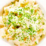 Close-up overhead creamy cheesy smoked haddock pasta made with penne.