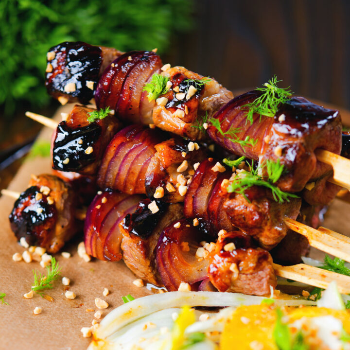 Grilled sticky duck kebabs on skewers with a sticky marmalade glaze.