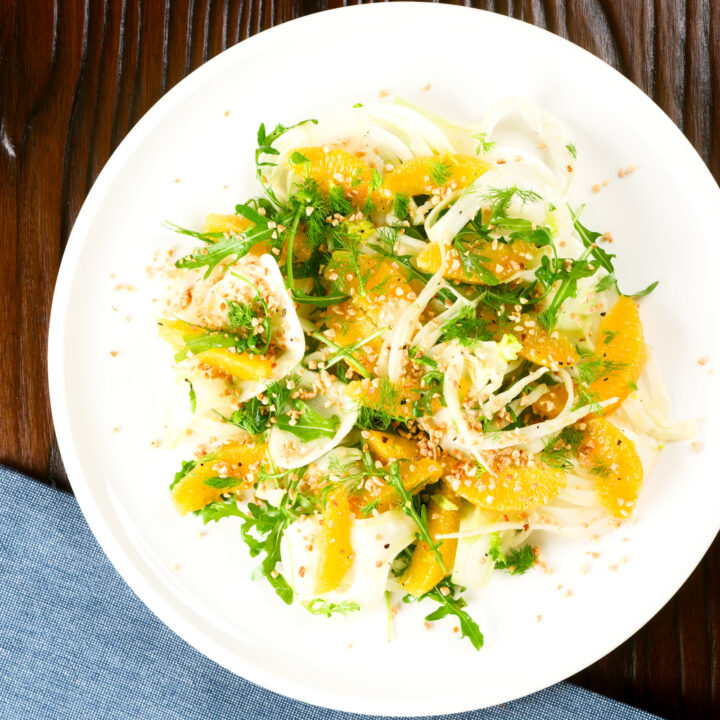 Fennel and orange salad with rocket (arugula) and toasted almonds.