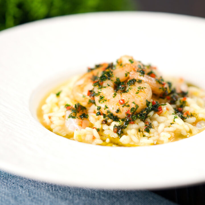 Spicy lemon and prawn risotto topped with sautéed shrimp with parsley and chilli.