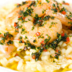 Close-up lemon and prawn risotto with chilli and parsley.