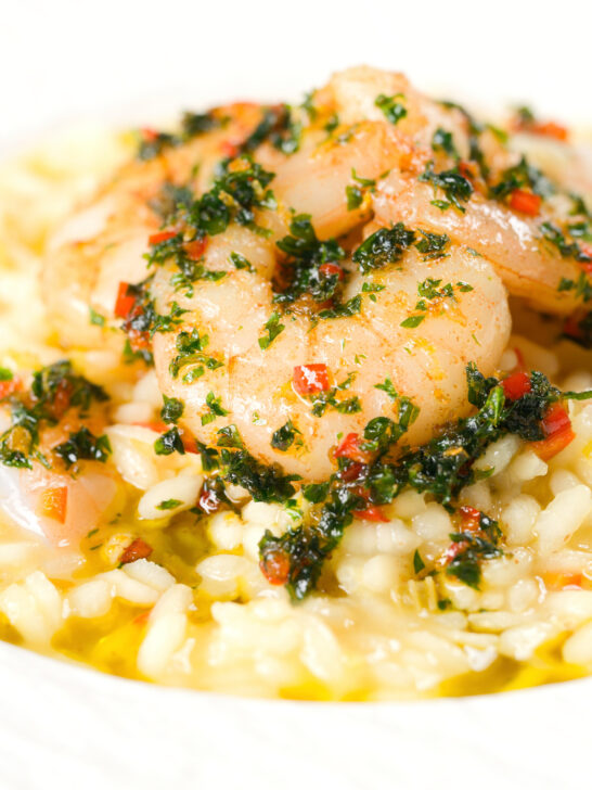 Close-up lemon and prawn risotto with chilli and parsley.