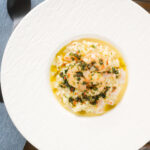 Overhead lemon and prawn risotto with chilli and parsley.