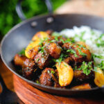 Sri Lankan pork belly curry with tamarind, black pepper and while garlic cloves.