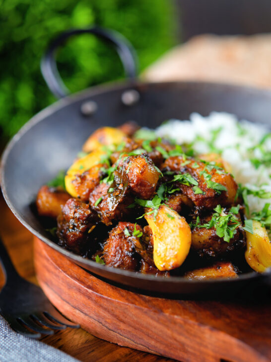 Sri Lankan pork belly curry with tamarind, black pepper and whole garlic cloves.