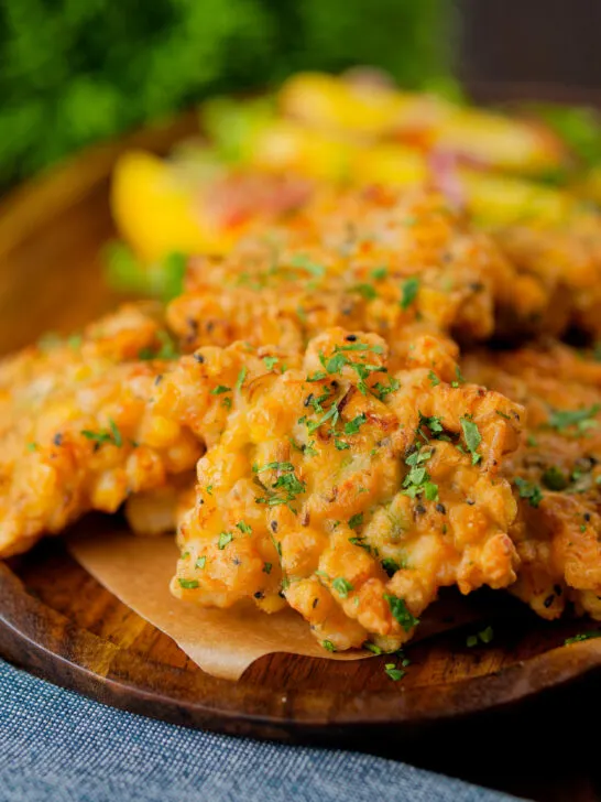 Prawn or shrimp and sweetcorn fritters served with a mango and red onion salad.