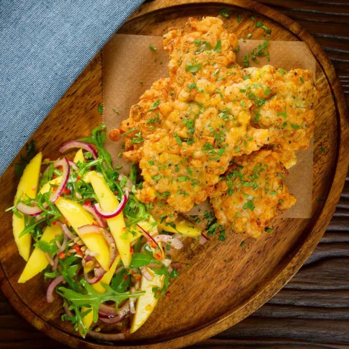 Easy prawn (shrimp) fritters served with a spicy mango salad.