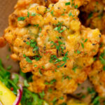 Close-up overhead fried prawn or shrimp and sweetcorn fritters.
