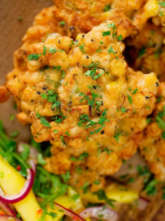 Close-up overhead fried prawn or shrimp and sweetcorn fritters.