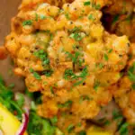 Close-up overhead fried prawn or shrimp and sweetcorn fritters.