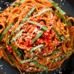 Close-up overhead one-pot spicy fried spaghetti all'assissina or bruciati.