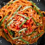 Close-up overhead one-pot spicy fried spaghetti all'assissina or bruciati.