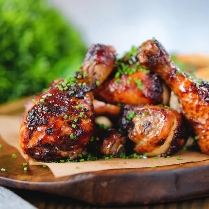 Oven-baked sticky chicken drumsticks with a cherry and balsamic glaze.