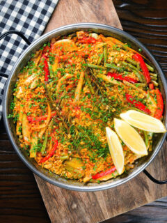 Overhead mixed vegetable paella with fennel and artichokes (Vegan & Vegetarian).